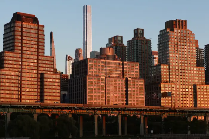 The sun sets over the West Side Highway in Manhattan on Sept. 19, 2023.